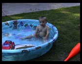 Naked boy in the pool.