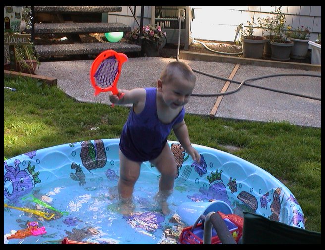 HAving fun with his fish racquet.