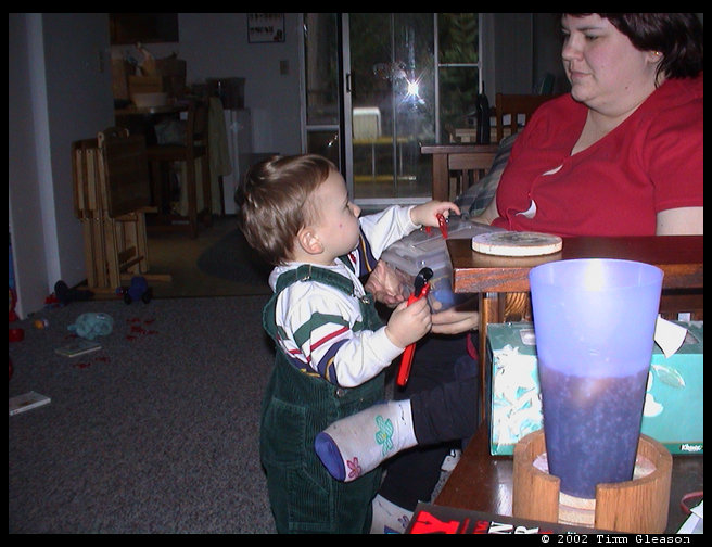 Showing mommy all of his toys.