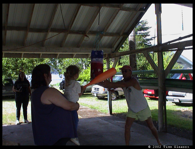 Maddie having a swing at the pinata.  