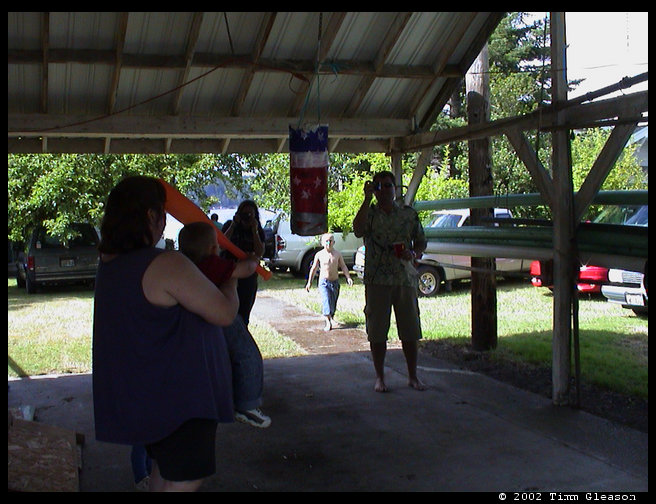 Logan hitting the pinata.  