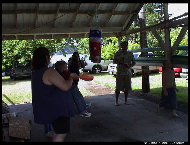 Helping Logan hit the pinata.  