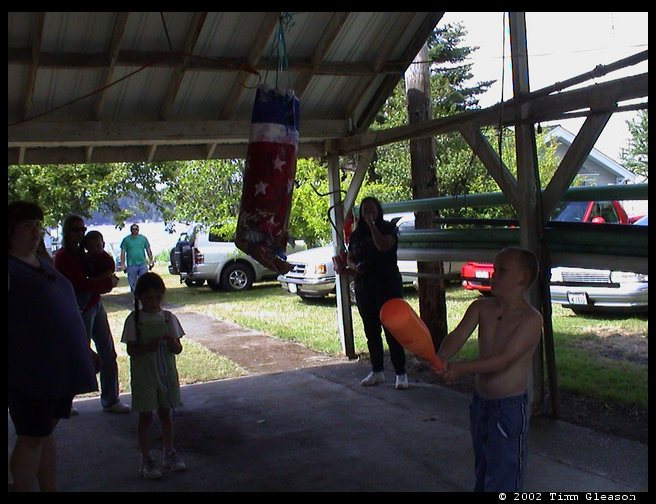 The pinata breaking open.
