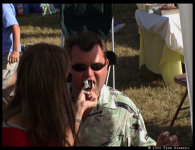 Jeff being fed cake.