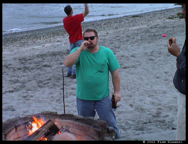 Mark enjoying a cigar and beer.