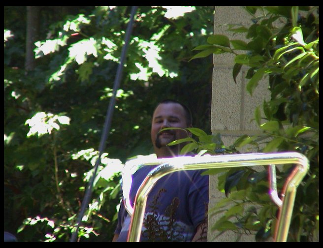 Timm hiding on the side of the house.