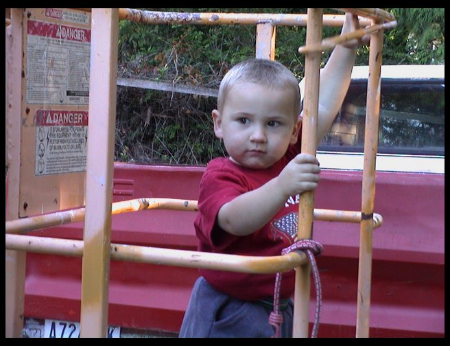 A close up of Logan in the boom basket.  