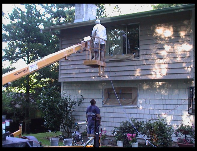 Thom ( a friend) on the boom and Timm on the ground.  More painting.  This day was actually a lot of fun and work. 