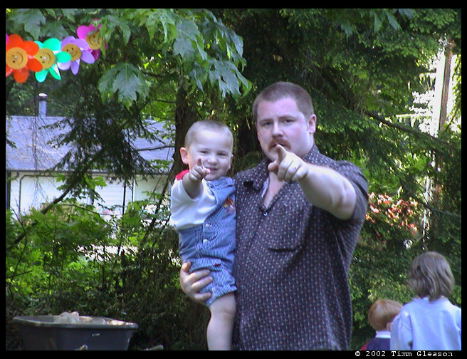 Uncle Mark & Logan pointing at mommy.