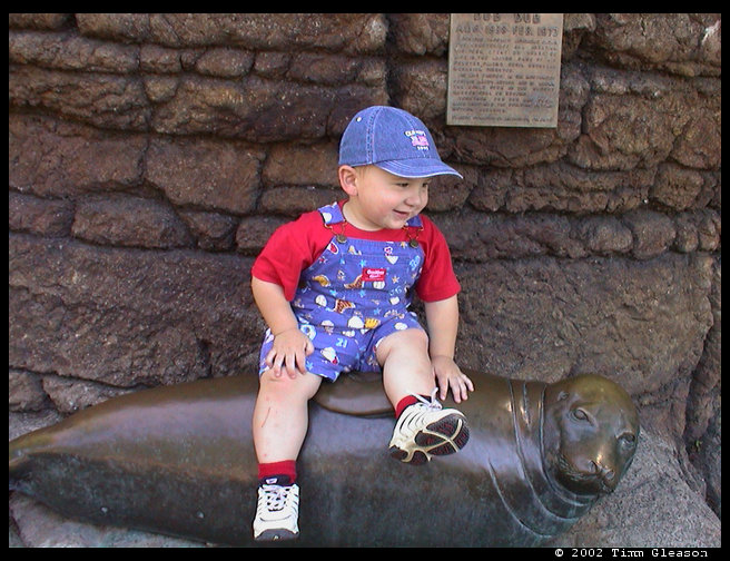 Logan on a seal sculpture. 