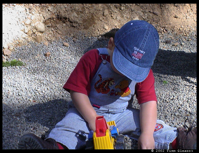 Playing in the pea gravel. 