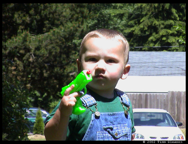 Logan and his squirt gun.