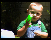 Logan posing with squirt gun. 