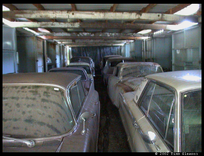 Cars in trailers at the property where part of the Harold LeMay collection is held.