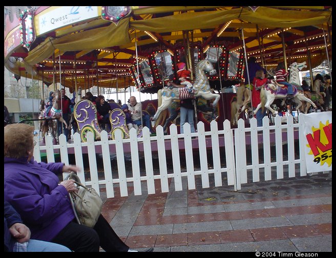 Grandpa and Logan on the Carousel in the bench seat.  