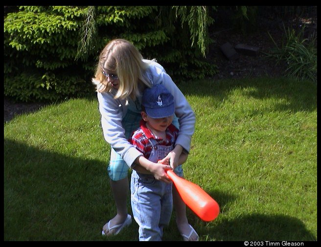 Lisa and Logan playing baseball at Grandma and Grandpas.