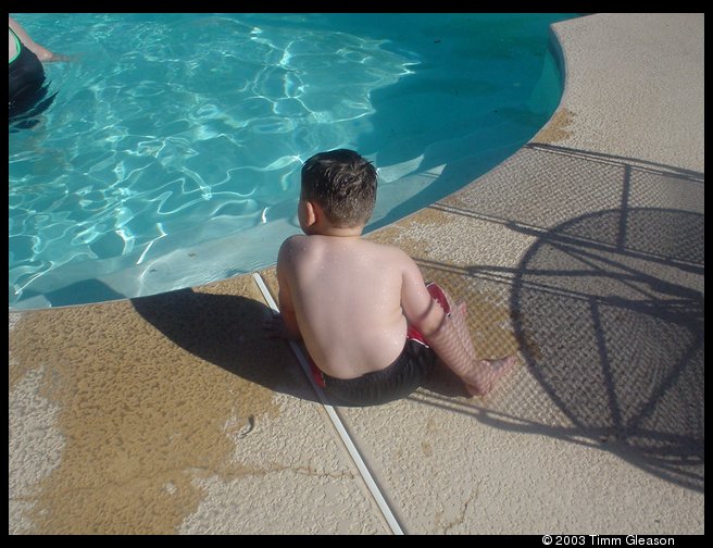 Logan at the neighbors pool at grandma Helens