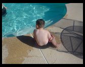 Logan at the neighbors pool at grandma Helens