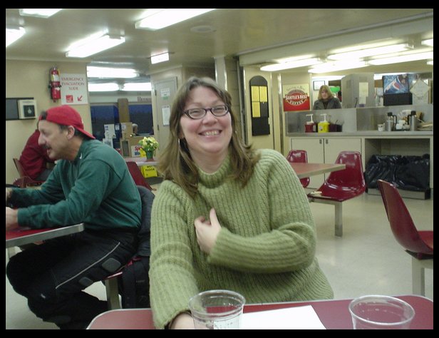 Lisa Paquin drinking on the boat