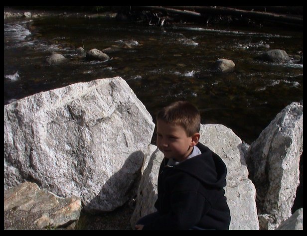 Logan on a rock next to the Wenatchee River
