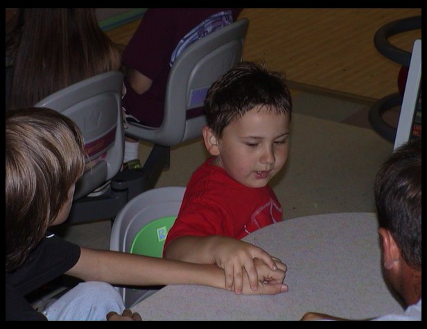 Logan holding Roberts hand.