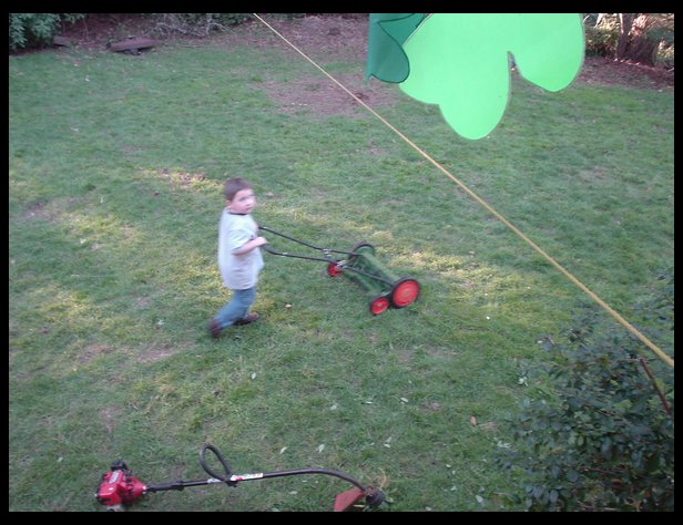 Chores already? Wow, yes....he is mowing the lawn.