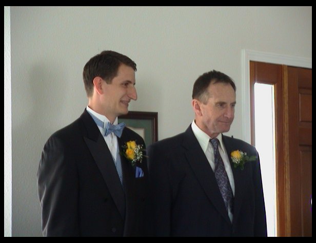 Jacob and his dad waiting for Jenny to come down the stairs.